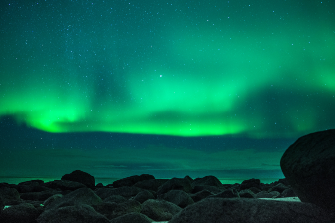5-northern-lights-over-rocky-shore-reykjavik